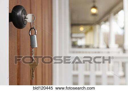 Stock Photography - Key in front door. Fotosearch