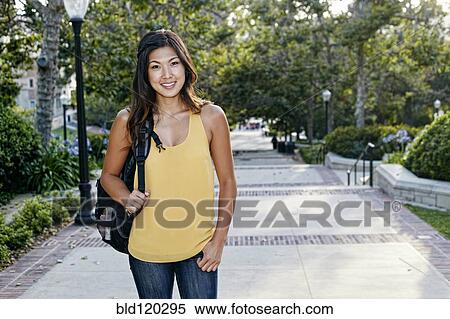 Stock Photography - Korean student smiling on campus. Fotosearch