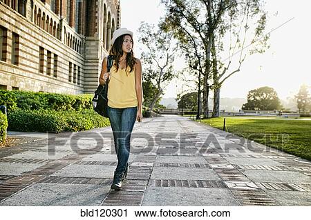 Korean student walking on campus View Large Photo Image Stock Image - Korean student walking on campus. Fotosearch