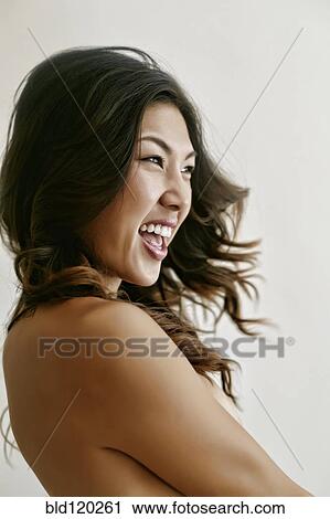 Stock Image - Korean woman cheering. Fotosearch