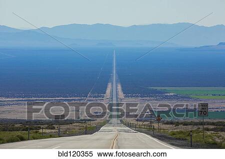 Stock Photography - Long road through rural landscape, Orovada, Nevada, United States, . Fotosearch