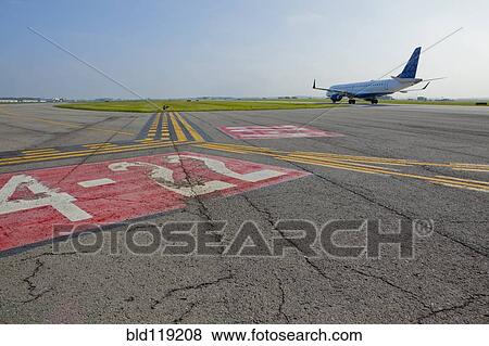 Stock Photo - Markings on airplane runway. Fotosearch