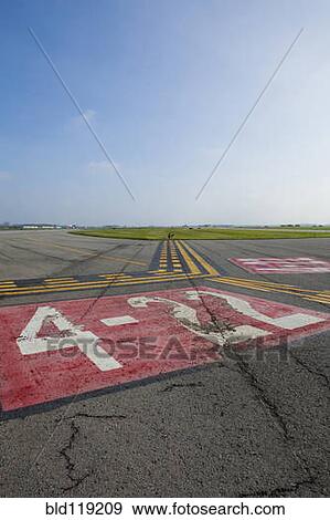 Stock Photo - Markings on airplane runway. Fotosearch