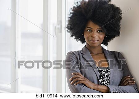 Picture - Mixed race businesswoman smiling. Fotosearch
