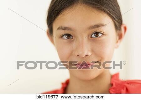 Stock Photo - Mixed race girl smiling. Fotosearch