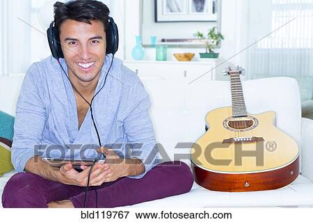 Mixed race teenager using digital tablet View Large Photo Image Stock Photo - Mixed race teenager using digital tablet. Fotosearch