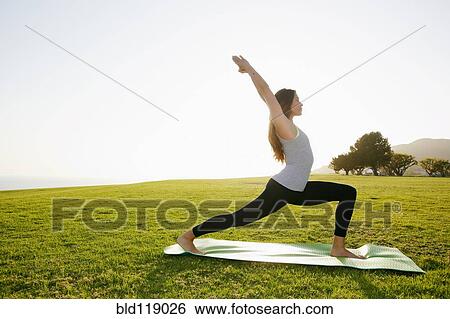 Mixed race woman practicing yoga in park View Large Photo Image Stock Photograph - Mixed race woman practicing yoga in park. Fotosearch