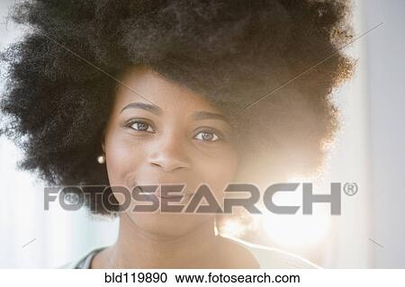 Stock Image - Mixed race woman smiling. Fotosearch