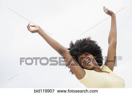 Stock Photo - Mixed race woman smiling. Fotosearch