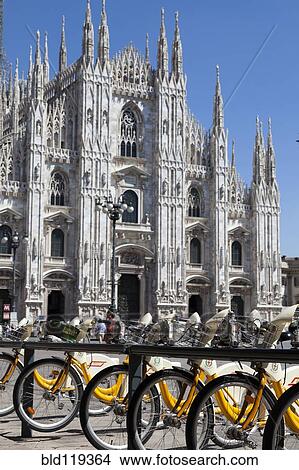 Picture - Ornate cathedral and bicycle parking, Milano, Lombardia, Italy. Fotosearch