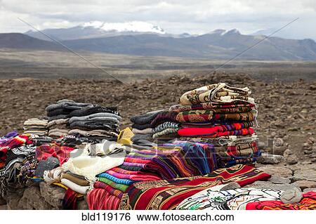 Piles of traditional cloth for sale at roadside market, Altiplano, Andeas, Peru View Large Photo Image Stock Photograph - Piles of traditional cloth for sale at roadside market, Altiplano, Andeas, Peru. Fotosearch