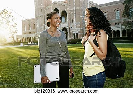 Stock Photograph - Professor and student talking on campus. Fotosearch