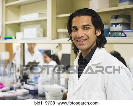 Scientist smiling in laboratory View Large Photo Image Stock Photo - Scientist smiling in laboratory. Fotosearch