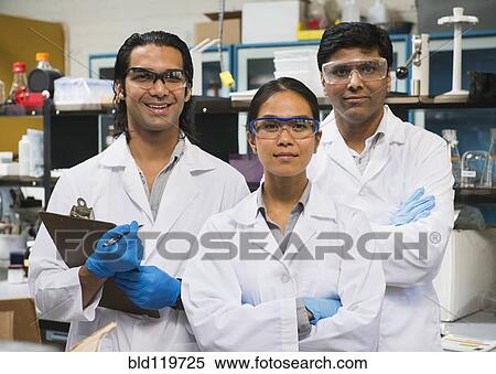 Stock Photography - Scientists smiling in laboratory. Fotosearch