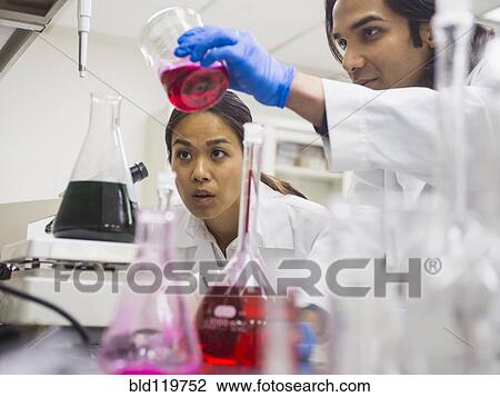 Stock Image - Scientists working in laboratory. Fotosearch