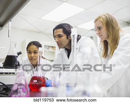 Stock Image - Scientists working in laboratory. Fotosearch