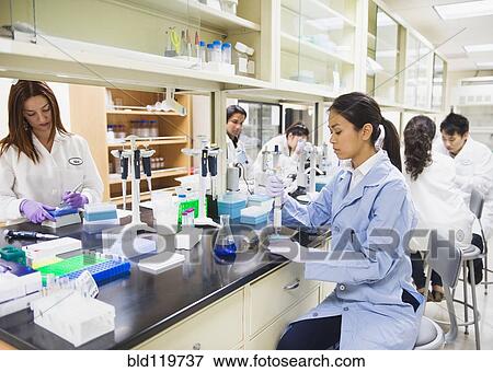 Stock Photo - Scientists working in laboratory. Fotosearch