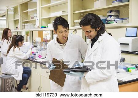 Stock Photo - Scientists working in laboratory. Fotosearch