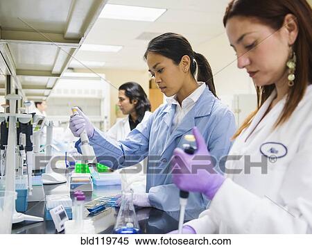 Stock Photography - Scientists working in laboratory. Fotosearch
