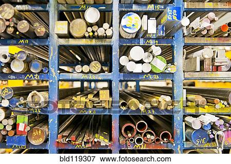 Stock Photo - Shelves of aluminum, steel and copper beams. Fotosearch