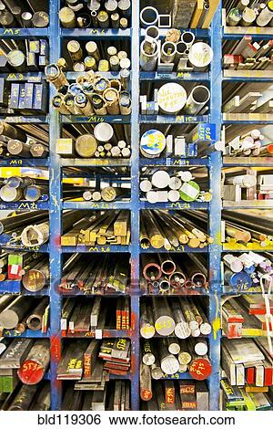 Stock Photograph - Shelves of aluminum, steel and copper beams. Fotosearch