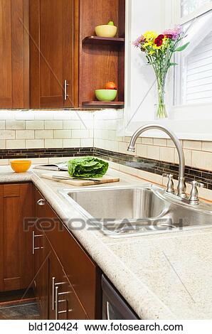 Picture - Sink and cabinets in kitchen. Fotosearch