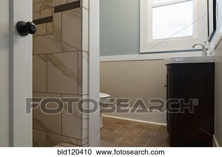 Stock Image - Sink and toilet in bathroom. Fotosearch