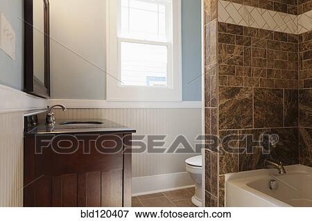 Sink, bathtub and toilet in bathroom View Large Photo Image Stock Photo - Sink, bathtub and toilet in bathroom. Fotosearch
