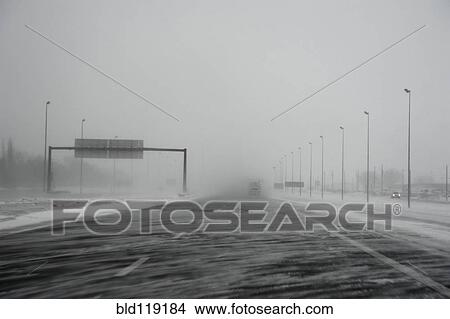 Picture - Snow blowing across highway. Fotosearch