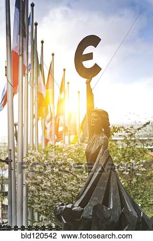Stock Image - Statue with Euro symbol outside European Union Parliament, Brussels, Belgium. Fotosearch