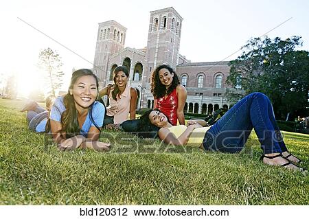 Students relaxing on campus View Large Photo Image Stock Image - Students relaxing on campus. Fotosearch