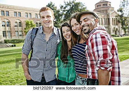 Stock Photo - Students smiling together on campus. Fotosearch