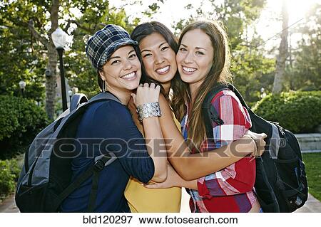 Stock Photo - Students smiling together on campus. Fotosearch