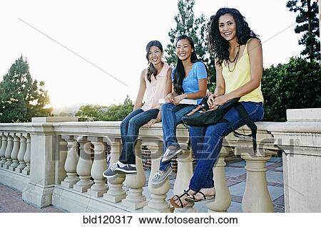 Students smiling together on campus View Large Photo Image Stock Photo - Students smiling together on campus. Fotosearch