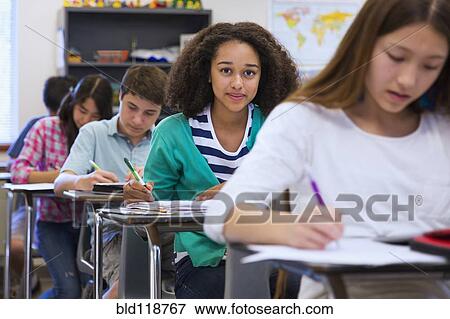 Stock Photo - Students taking notes in class. Fotosearch