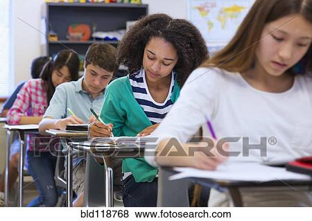 Stock Photo - Students taking notes in class. Fotosearch
