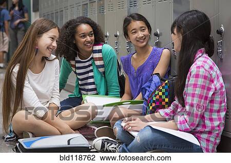 Students talking in school corridor View Large Photo Image Stock Image - Students talking in school corridor. Fotosearch