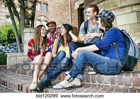 Stock Photo - Students talking on campus steps. Fotosearch
