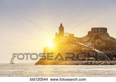 Picture - Sun rising over castle on island, Portovenere, Liguria, La Spezia, Italy. Fotosearch