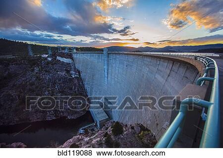 Stock Photo - Sun rising over dam, Daggett, Utah, United States. Fotosearch