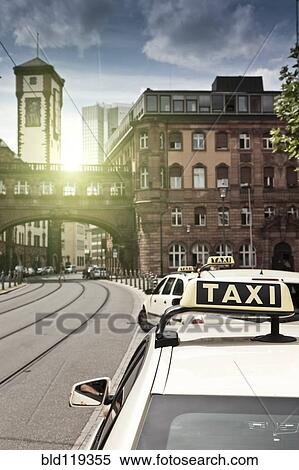 Stock Photography - Sun rising over urban skybridge, Frankfurt, Frankfurt, Germany. Fotosearch