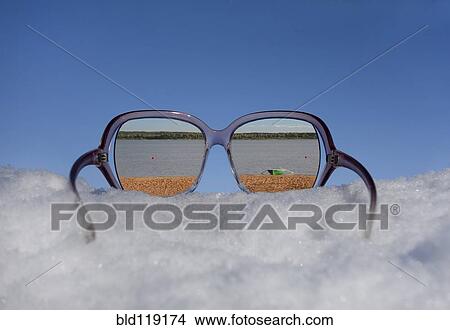 Sunny beach reflected in sunglasses in snow View Large Photo Image Picture - Sunny beach reflected in sunglasses in snow. Fotosearch