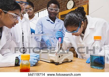 Picture - Teacher and students working in science lab. Fotosearch