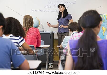 Teacher talking in class View Large Photo Image Picture - Teacher talking in class. Fotosearch