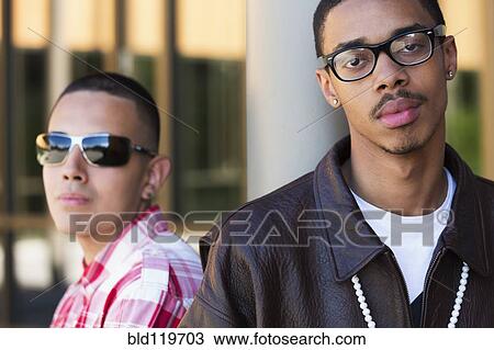 Teenage boys standing outdoors View Large Photo Image Stock Image - Teenage boys standing outdoors. Fotosearch