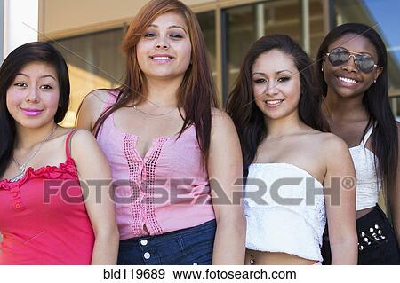 Stock Photo - Teenage girls smiling outdoors. Fotosearch