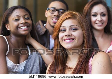 Teenagers smiling outdoors View Large Photo Image Stock Photograph - Teenagers smiling outdoors. Fotosearch