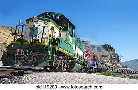 Train on tracks in rural landscape View Large Photo Image Stock Image - Train on tracks in rural landscape. Fotosearch