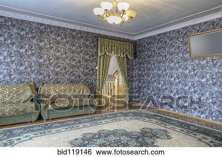 Stock Photograph - Wallpaper, sofa and drapes in ornate room. Fotosearch