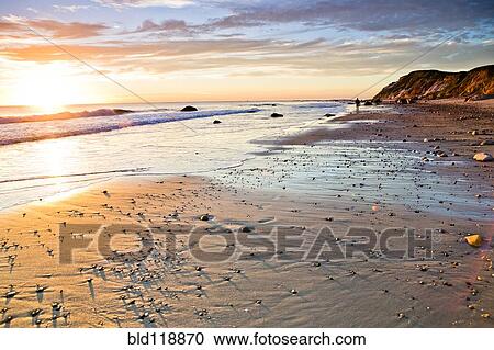 Waves washing up on rocky beach View Large Photo Image Stock Image - Waves washing up on rocky beach. Fotosearch